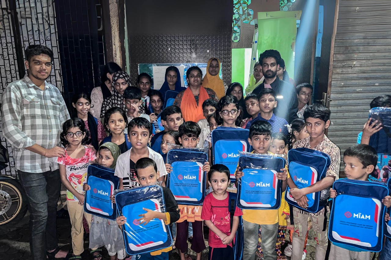 Children receiving MIAM school bags, Dharavi Mumbai